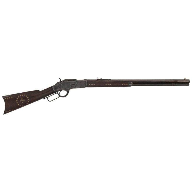 Tack Decorated Winchester Model 1873 3rd Model: Tack Decorated Winchester Model 1873 3rd Model .44-40 WCF. 24" octagonal barrel length. SN: 401935 (Mfg. ca.1891). Blued metal finish to barrel, and case hardened finish to parts. Two piece oil f