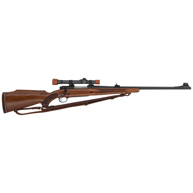 ** Winchester Model 70 with Lyman Alaskan Scope: ** Winchester Model 70 with Lyman Alaskan Scope .338 WIN Mag. 24" barrel length. SN: 771541 (Mfg. ca.1965). Blued metal finish to barrel and parkerized finish to receiver. Walnut Monte Carlo