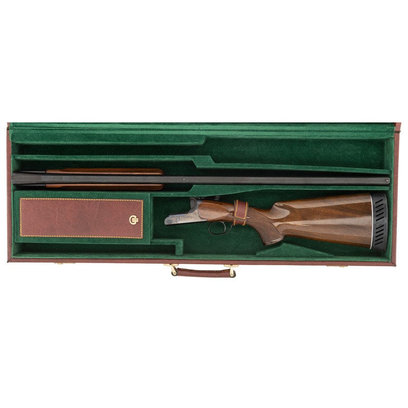 * Cased Ithaca TM1 Single Barrel Trap Shotgun by Perazzi: * Cased Ithaca TM1 Single Barrel Trap Shotgun by Perazzi 12 gauge. 33.75" barrel length. SN: 6334. Blued metal finish. Two piece walnut stock has checkering to semi pistol grip and beavertai