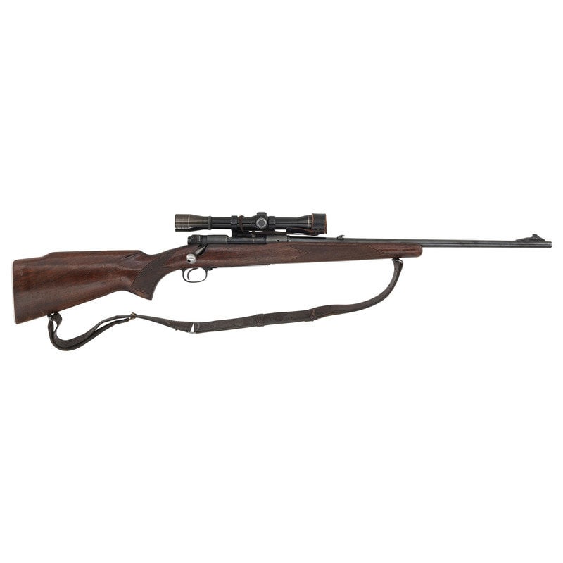 ** Pre-64 Winchester Model 70 Rifle with Lyman All-American Scope: ** Pre-64 Winchester Model 70 Rifle with Lyman All-American Scope .270 WIN. 22" barrel length. SN: 342114 (Mfg. ca.1955). Blued metal finish. Walnut stock has checkering to semi pistol grip