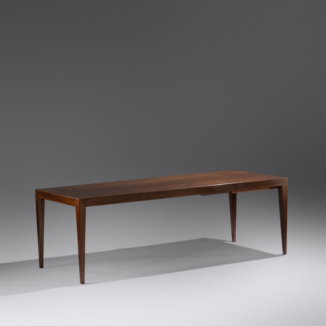 Severin Hansen (1914-1987) Coffee Table with Pull-Out Tray, c. 1960 Haslev A/S, Denmark: Severin Hansen (1914-1987) Coffee Table with Pull-Out Tray, c. 1960 Haslev A/S, Denmark rosewood, laminate with manufacturer's label H 19 3/4 x W 59 x D 23 1/2 inches.