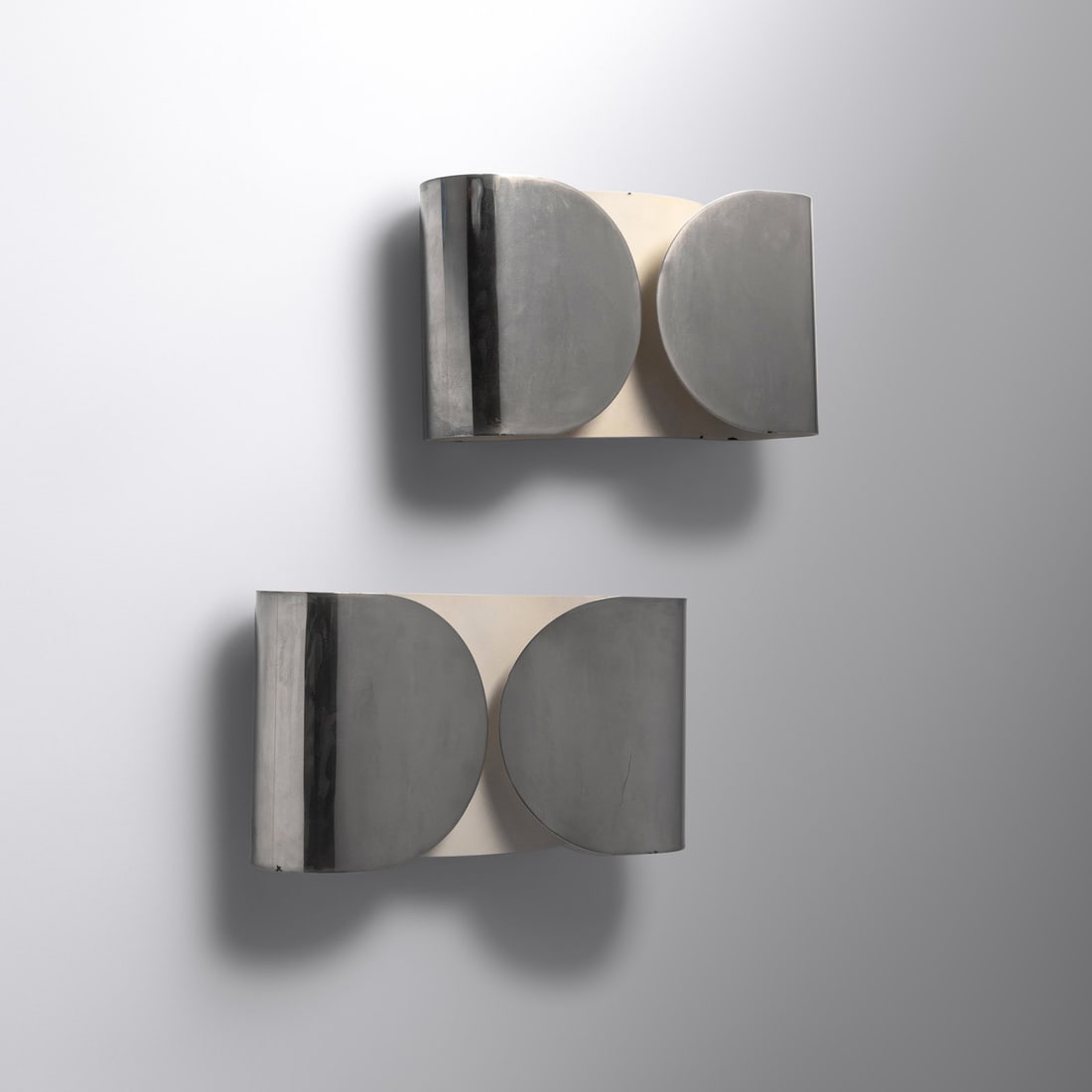Afra and Tobia Scarpa (1937-2011 | b. 1935) Pair of 'Foglio' Sconces, c. 1970 Flos, Italy: Afra and Tobia Scarpa (1937-2011 | b. 1935) Pair of 'Foglio' Sconces, c. 1970 Flos, Italy chrome-plated, enameled steel H 8 1/2 x W 14 1/2 x D 4 1/2 inches