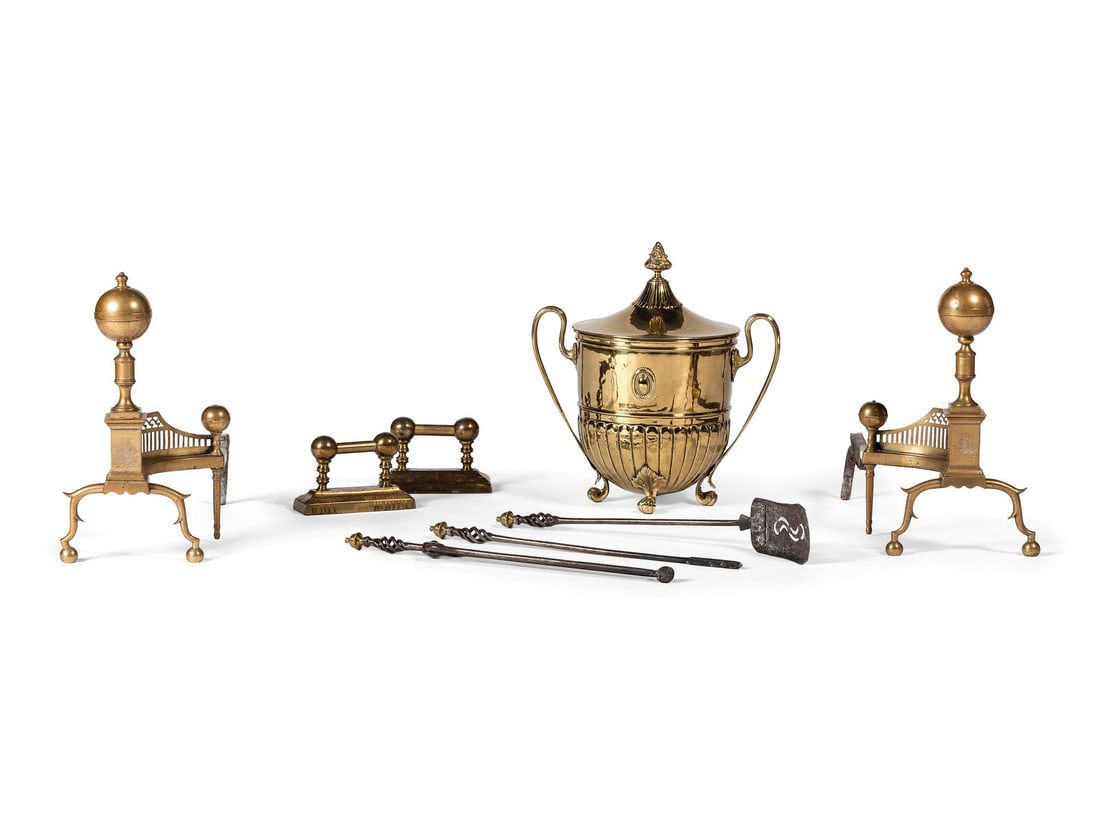 A Pair of Federal Engraved Brass Ball-Top Andirons: A Pair of Federal Engraved Brass Ball-Top Andirons Early 19th Century each engraved with a ship and monogrammed W to plinth. together with brass and iron fireplace tools, including a coal hood, a shov