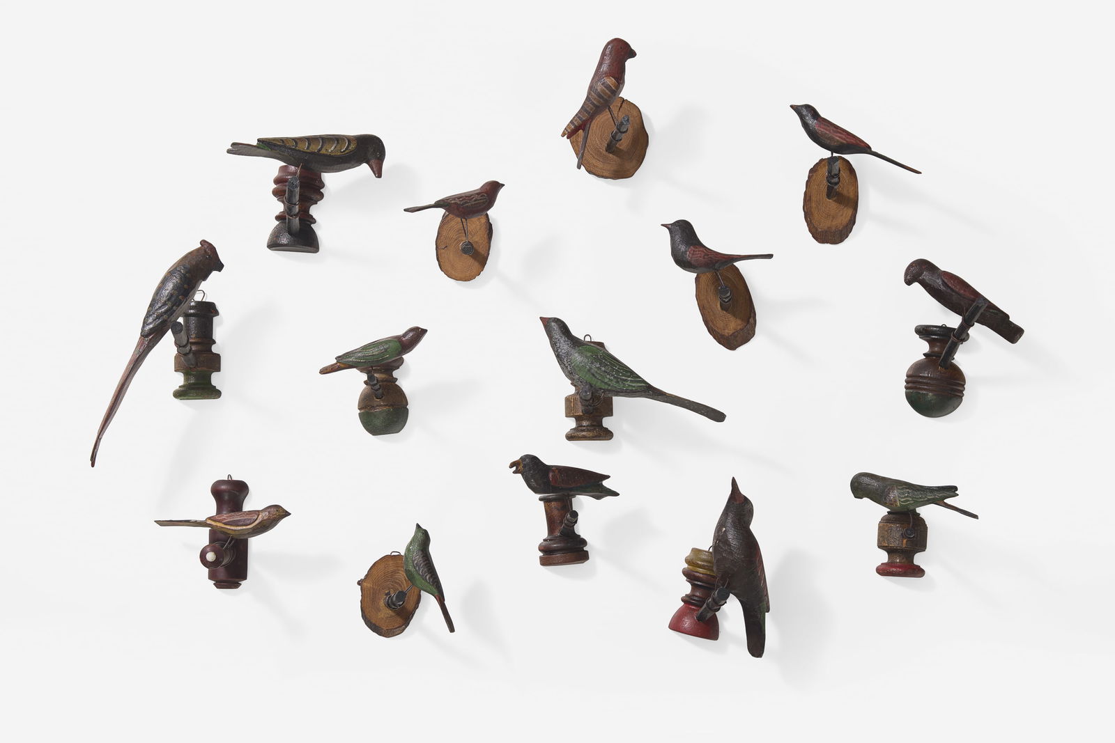 A group of fourteen carved and painted wood birds or bird groups (1 of 2)