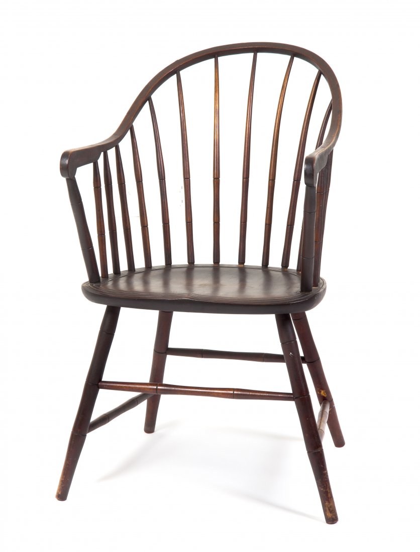 A Windsor Arm Chair, Height 36 inches.: A Windsor Arm Chair, having a yoke form crest rail over the spindled back and plank seat, raised on splayed legs joined by stretchers. Height 36 inches. Property from the Collection of Mrs. Jean S. Li