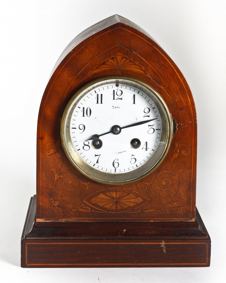 A Victorian Ebonized Wood Mantel Clock, Height of : A Victorian Ebonized Wood Mantel Clock, having an arched crest over a molded cornice above the circular dial with Arabic numerals, flanked by engaged half columns, the whole with gilt metal mounts thr