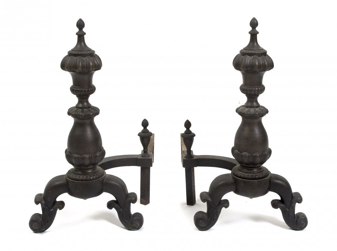 A Pair of Cast Iron Andirons, Height 23 1/2 inches: A Pair of Cast Iron Andirons, each having a sphere finial on a square standard raised on two feet. Height 23 1/2 inches.