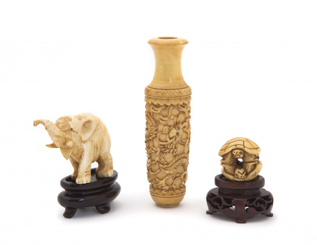 Three Carved Ivory Articles, Height of tallest 3 3: Three Carved Ivory Articles, comprising a diminutive vase decorated with dragons, a turtle netsuke and an elephant, together with two associated diminutive bases. Height of tallest 3 3/4 inches.