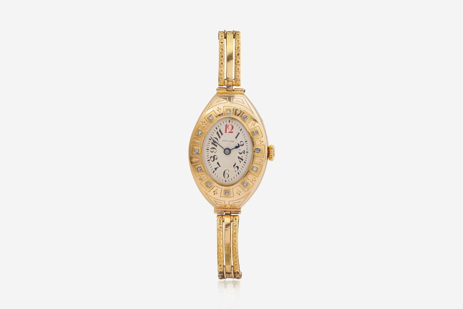 A Ladies 14K Yellow Gold Russian Invicta Watch with Diamonds: A Ladies 14K Yellow Gold Russian Invicta Watch with Diamonds A 14K yellow gold Russian manual wind ladies watch by Invicta, featuring an oval silvery white face with a red Arabic numeral at the 12 o'c