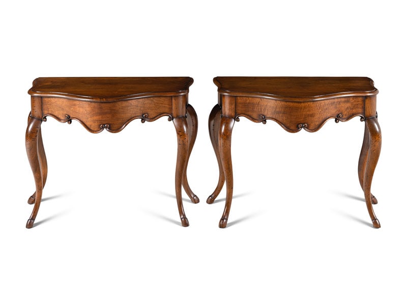 A Pair of Rococo Style Serpentine Console Tables: A Pair of Rococo Style Serpentine Console Tables 20th Century Height 32 x width 39 1/2 x depth 20 1/2 inches. This lot is located in Chicago.