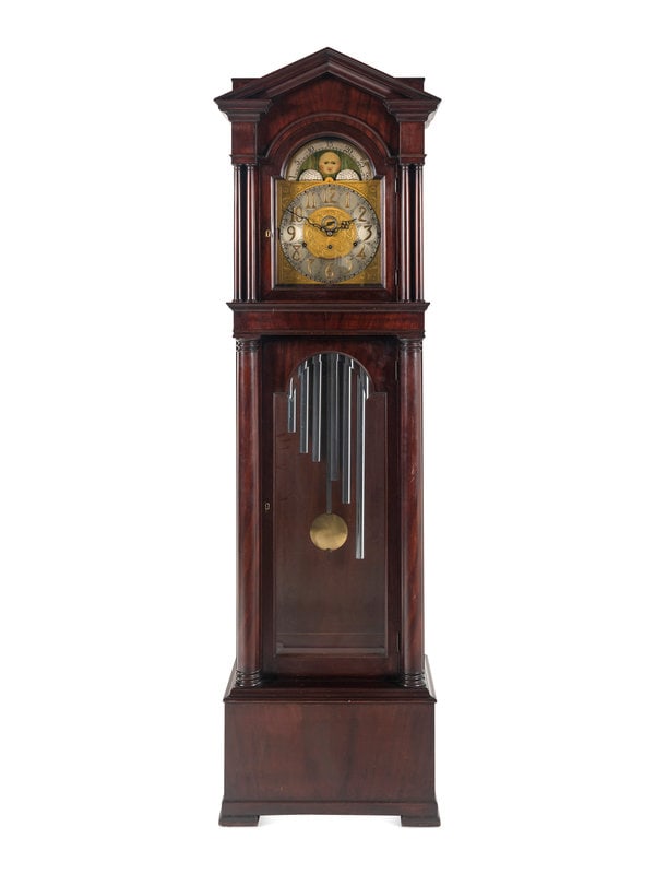 A Mahogany Tall Case Clock: A Mahogany Tall Case Clock 20th Century having six tubes, with the face marked Germany and the movement marked B&D Limited. Height 94 1/2 x width 25 x depth 18 1/2