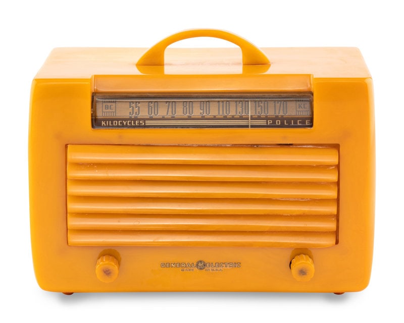 A General Electric L570 Radio: A General Electric L570 Radio 1941 having a yellow case with matching handle, louvered grille and knobs.Height 6 1/4 x length 9 1/2 x depth 6 inches. This lot is located in