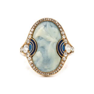 RENÉ LALIQUE, ART NOUVEAU, PATE DE VERRE, DIAMOND AND ENAMEL RING: RENÉ LALIQUE, ART NOUVEAU, PATE DE VERRE, DIAMOND AND ENAMEL RINGConsisting of a pâte de verre plaque depicting the profile of a female and floral detail, with a blue enamel and diamond surround. 