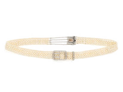 CARTIER, EDWARDIAN, SEED PEARL AND DIAMOND CHOKER NECKLACE: CARTIER, EDWARDIAN, SEED PEARL AND DIAMOND CHOKER NECKLACE Consisting of a strung seed pearl necklace with platinum buckle motif fittings set with single cut diamonds. 13 1/2 inches long. Stamp: CARTI
