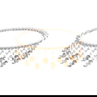 DIAMOND AND COLORED DIAMOND BANGLE BRACELET: DIAMOND AND COLORED DIAMOND BANGLE BRACELET Containing numerous round brilliant cut white and brown diamonds (origin of color not tested) weighing approximately 4.00 carats total and 15 briolette brow