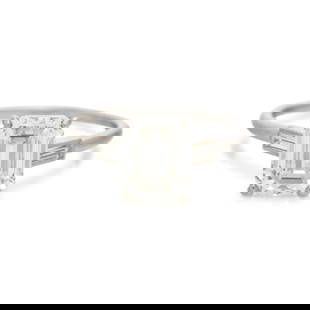 MONTURE CARTIER, DIAMOND RING: MONTURE CARTIER, DIAMOND RING Containing one emerald cut diamond weighing 3.30 carats and two baguette cut diamonds. Mounted in platinum. Ring size 8. Stamp: (French hallmark). Engraved: MONTURE Carti