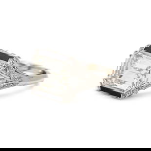 CARTIER, LONDON, ART DECO, PLATINUM AND DIAMOND RING: CARTIER, LONDON, ART DECO, PLATINUM AND DIAMOND RING Containing one emerald cut diamond weighing approximately 5.20 carats, set in a platinum mounting with old mine and trapezoid cut diamonds, channel