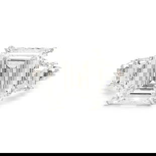 AN IMPORTANT DIAMOND RING: AN IMPORTANT DIAMOND RING Containing one emerald cut diamond weighing 4.45 carats and two trapezoid cut diamonds. Mounted in platinum. Ring size 5 1/4. Stamp: PT 950 13827. Gross weight: 3.90 dwt. GIA
