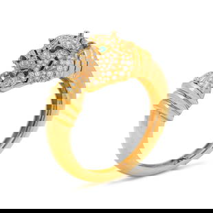 DAVID WEBB, DIAMOND, EMERALD AND ENAMEL TIGER BANGLE BRACELET: DAVID WEBB, DIAMOND, EMERALD AND ENAMEL TIGER BANGLE BRACELET Consisting of a bangle with tiger's head clasp containing round brilliant and single cut diamonds weighing approximately 6.00-7.00 carats