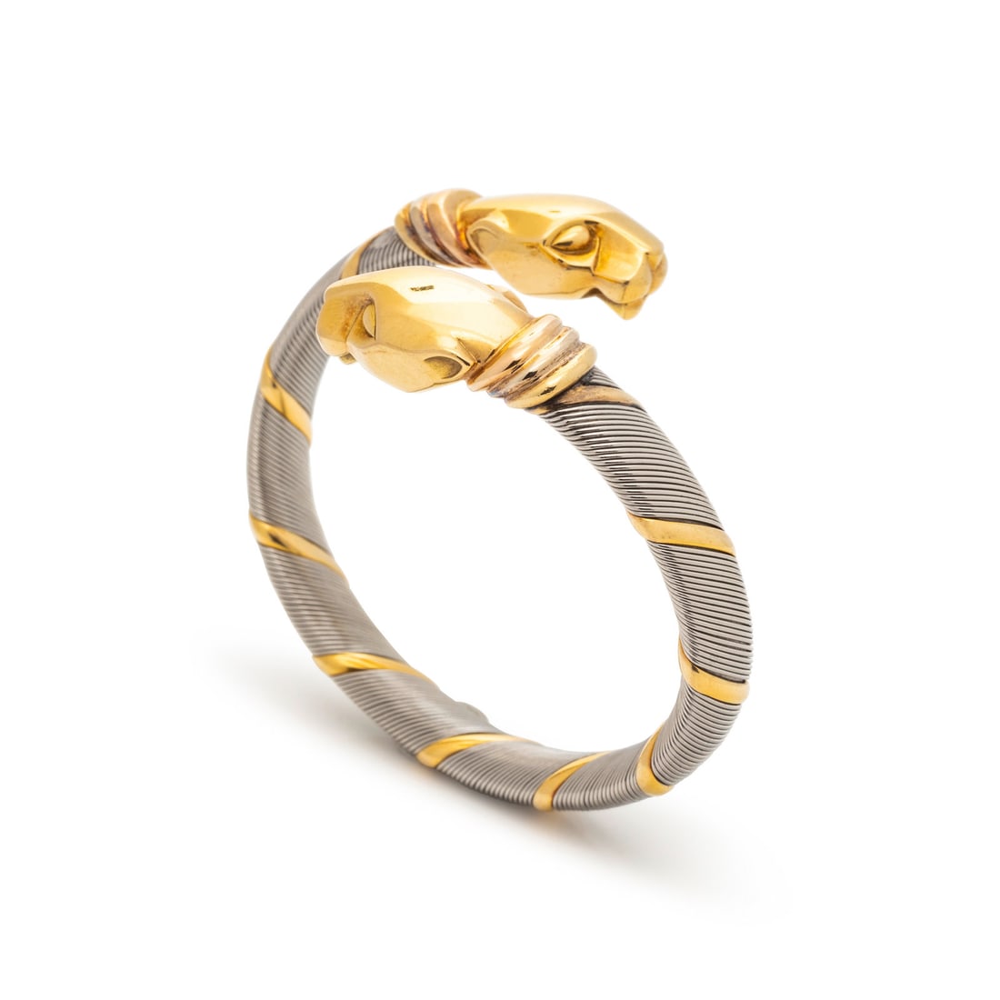 CARTIER, STEEL AND YELLOW GOLD PANTHER BYPASS BANGLE BRACELET (1 of 3)
