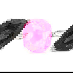 SPAULDING-GORHAM, UNHEATED BURMESE RUBY AND DIAMOND RING: SPAULDING-GORHAM, UNHEATED BURMESE RUBY AND DIAMOND RING Containing one cushion cut ruby measuring approximately 11.40 x 9.96 x 5.60 mm and weighing approximately 5.70 carats with two baguette diamond