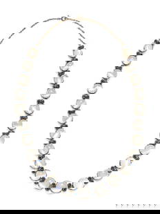 MOONSTONE AND SAPPHIRE NECKLACE: MOONSTONE AND SAPPHIRE NECKLACE Containing round cabochon moonstones and round mixed cut sapphires. Mounted in silver. 17 inches long. Gross weight: 26.35 dwt. Property from the Collection of Margueri
