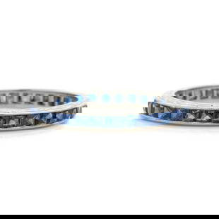 PLATINUM AND SAPPHIRE ETERNITY BAND: PLATINUM AND SAPPHIRE ETERNITY BAND Containing numerous French cut sapphires. Ring size 4 1/2. Gross weight: 1.50 dwt. Property from the Estate of Marguerite Hark, Chicago, Illinois and Surfside, Flor