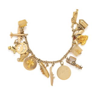 YELLOW GOLD CHARM BRACELET: YELLOW GOLD CHARM BRACELET Consisting of a curb link chain suspending 15 charms. 6 3/4 inches long. Bracelet stamp: 14Kt. Gross weight: 25.40 dwt. Property from the Collection of Marguerite Hark, Chic