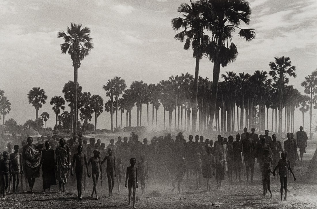 Sebastião Salgado   (born 1944) The population of the cattle camp of Kenya walk toward the (1 of 3)