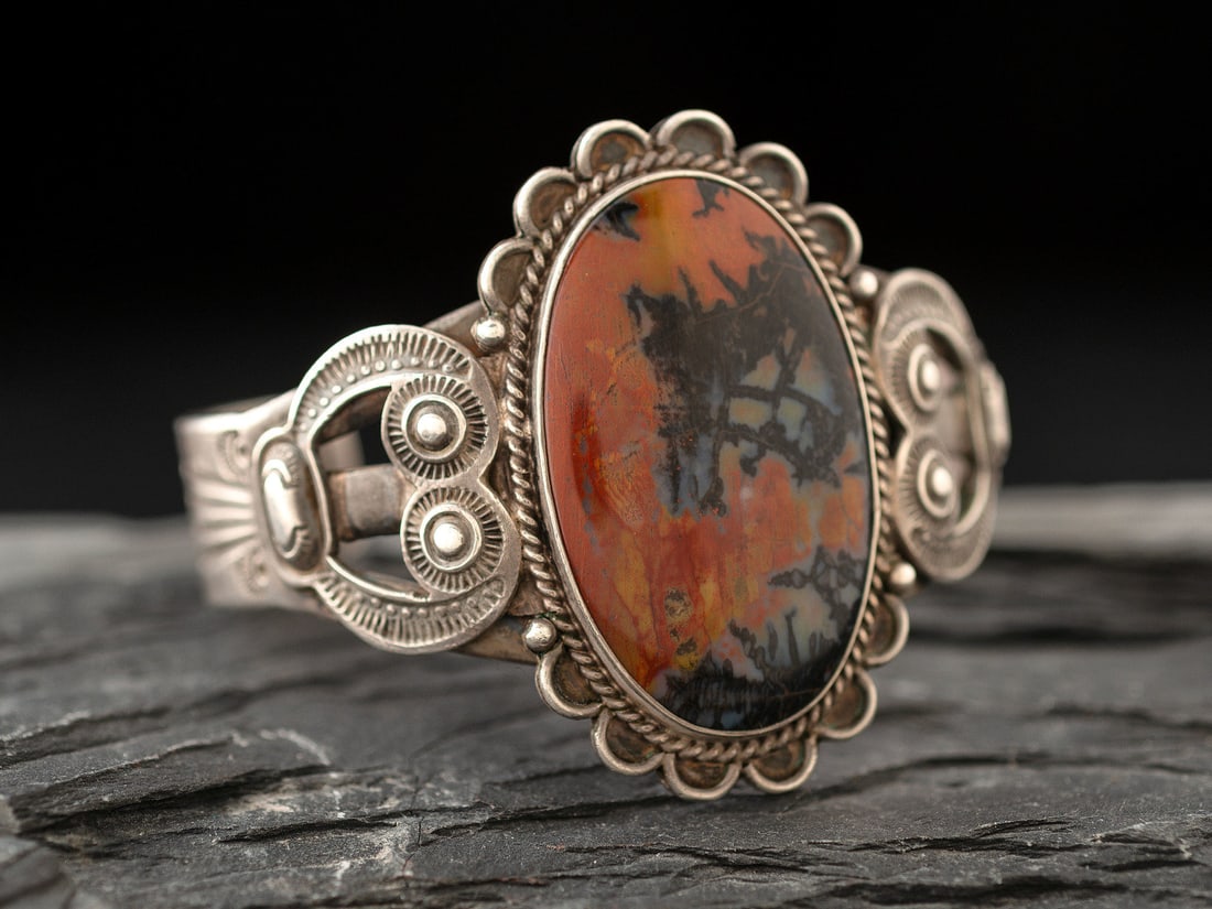 Fred Peshlakai  (Diné, 1896-1975) Heavily Stamped Split Shank Cuff, with Petrified Wood (1 of 3)