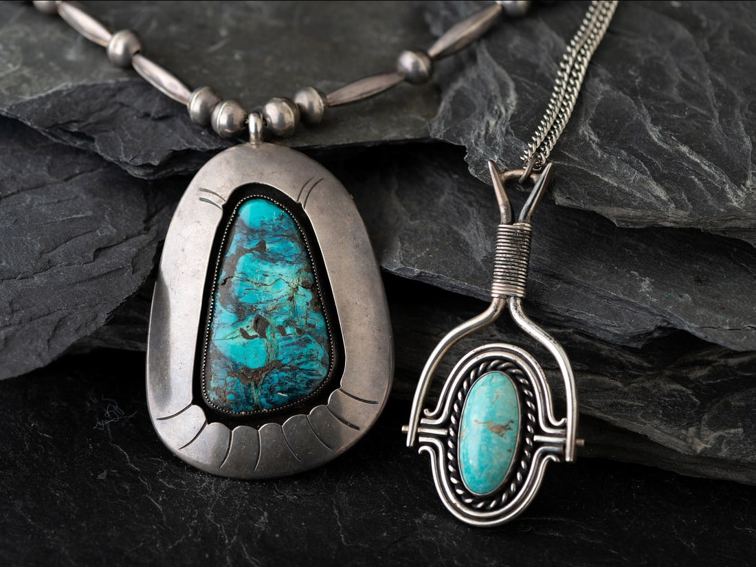 Navajo Silver and Turquoise Necklaces: Navajo Silver and Turquoise Necklaces third quarter 20th century lot of 2, includes: one with a swivel pendant set with a single cabochon in a rope bezel; not marked chain length 24 inches, pendant le
