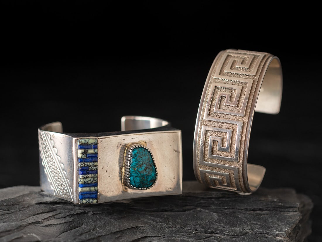 Raynard Scott (Diné, b. 1965) Sterling Silver Tufa Cast Cuff Bracelet : Raynard Scott (Diné, b. 1965) Sterling Silver Tufa Cast Cuff Bracelet lot of 2, includes: one with a Greek key pattern; signed R. J. SCOTT and marked STERLING cuff width 1 inch, interior circumfe