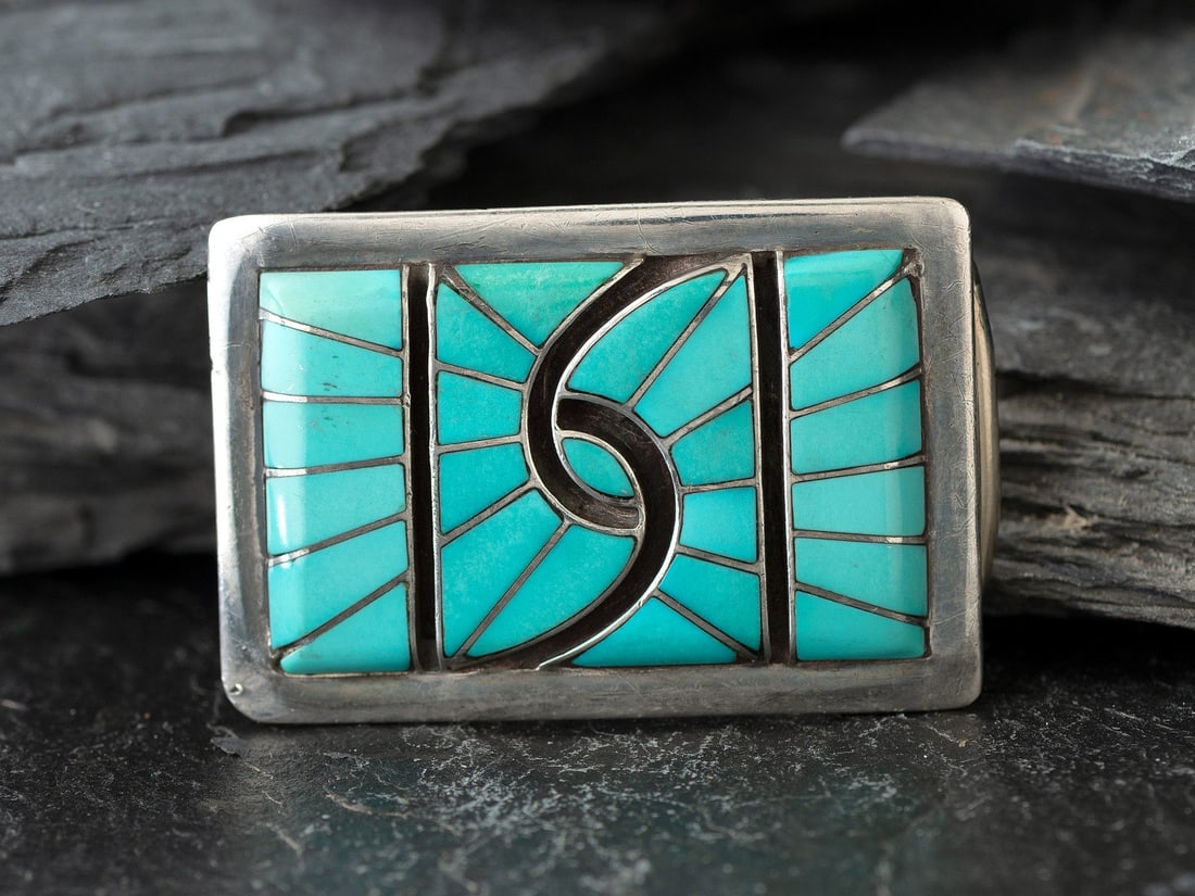 Amy Quandelacy (Zuni, b. 1953) Silver and Channel Inlay Turquoise Belt Buckle: Amy Quandelacy (Zuni, b. 1953) Silver and Channel Inlay Turquoise Belt Buckle signed AMY length 2 inches x width 1-3/8 inches, belt width 7/8 inch, weight 16.0 dwt. This lot is located in Cincinnati.