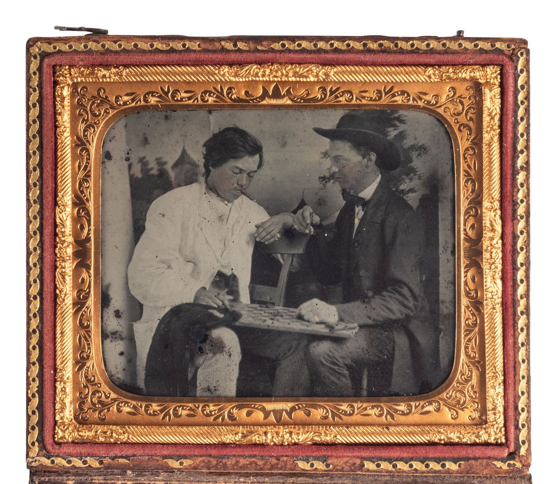 [EARLY PHOTOGRAPHY]. Sixth plate ruby ambrotype showing an intense game of checkers. (1 of 2)