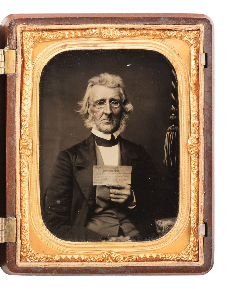 [EARLY PHOTOGRAPHY]. Quarter plate ambrotype of an aged gentleman holding up an affectionate note to (1 of 2)