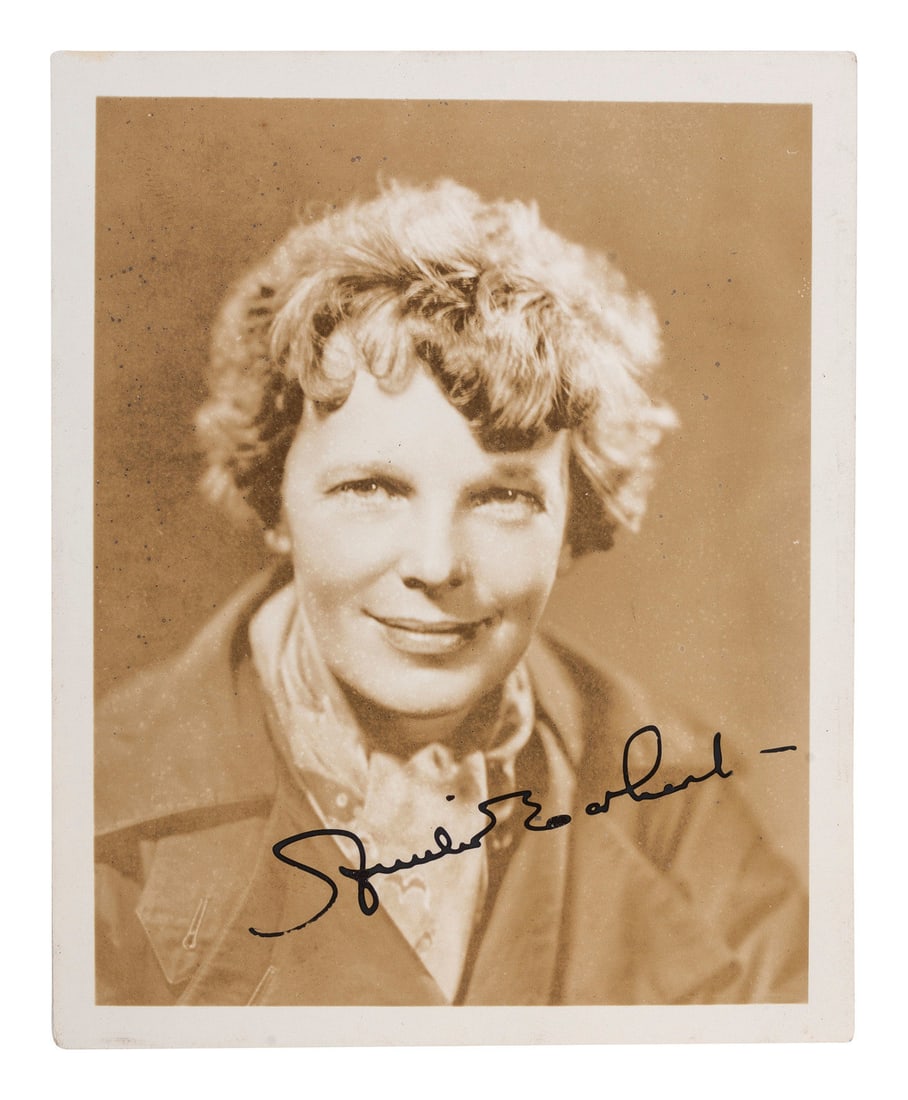 EARHART, Amelia (1897-1937). Photograph signed. [With:] Last Flight. 1937. (1 of 3)