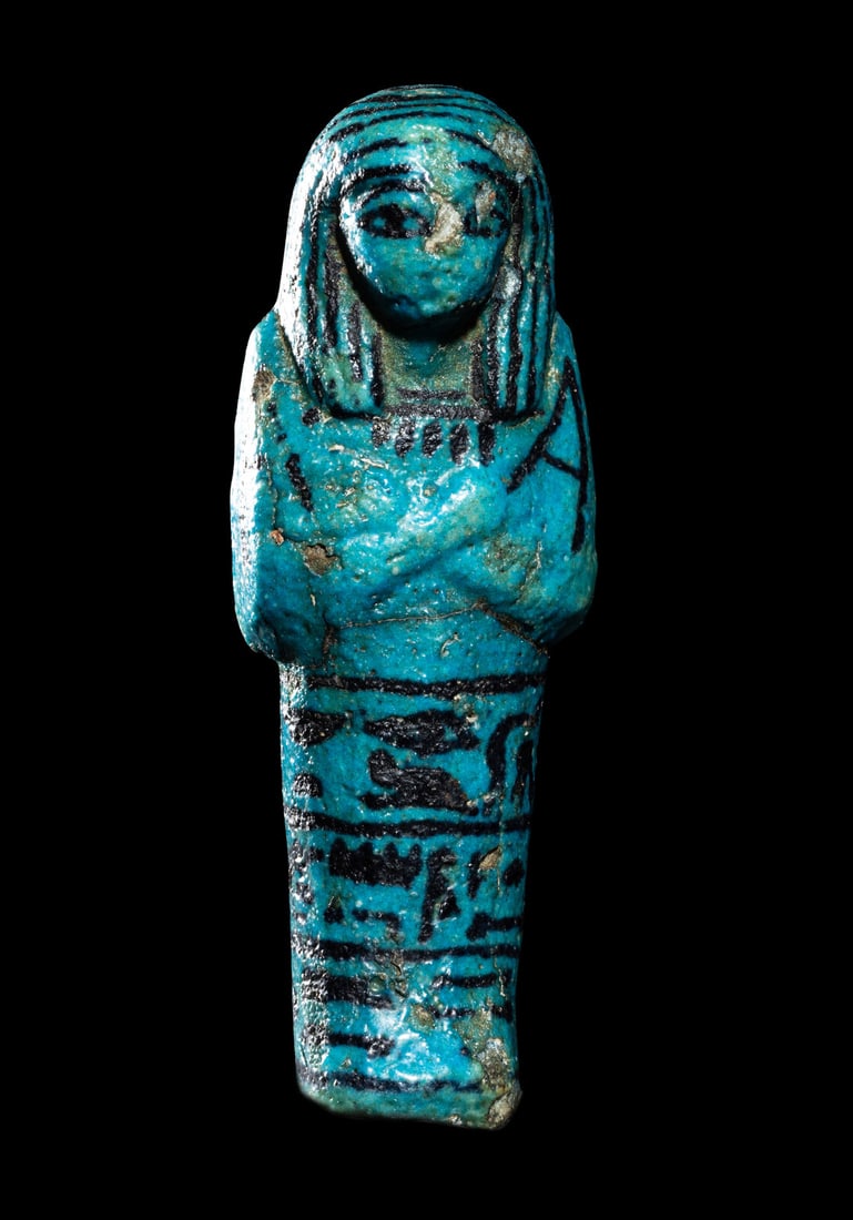 An Egyptian Blue Faience Ushabti for the Mistress of the House and Chantress of Amun, Muthotep (1 of 4)