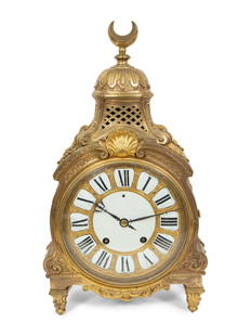 A Louis XIV Gilt Bronze Quarter Repeating Table Clock for the Middle Eastern Market: A Louis XIV Gilt Bronze Quarter Repeating Table Clock for the Middle Eastern Market Thuret, Paris, Circa 1740 with a segmented enamel dial; the regulation square under numeral XII, signed on the