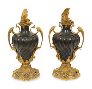 A Pair of French Gilt and Patinated Bronze Urns: A Pair of French Gilt and Patinated Bronze Urns Early 19th Century Height 12 1/2 inches. This lot is located in Palm Beach. Property from the Estate of Joanna Hoffman, Palm Beach, and Her Father,