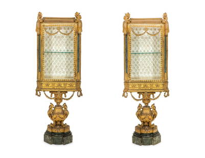 A Pair of Napoleon III Gilt Bronze Vitrines: A Pair of Napoleon III Gilt Bronze Vitrines Third Quarter 19th Century each raised on a gilt bronze pedestal atop a marble plinth. Height 55 1/2 x width 19 x depth 11 inches. Property from a Private