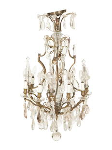 A Louis XV Style Gilt Bronze and Cut Glass Eight-Light Chandelier: A Louis XV Style Gilt Bronze and Cut Glass Eight-Light Chandelier 19th Century Height 36 x diameter 24 inches. This lot is located in Palm Beach. Property from a Private Collection, Stuart, Florida 