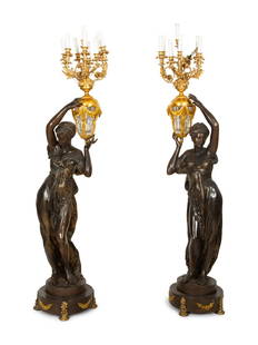 A Pair of French Gilt and Patinated Bronze Figural Nine-Light Torchères: A Pair of French Gilt and Patinated Bronze Figural Nine-Light Torchères 19th Century Height to top of bobeche, 72 1/2 x base diameter 18 inches. This lot is located in Palm Beach. Property from a