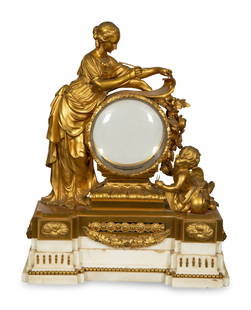 A Louis XVI Gilt Bronze Mounted Marble Mantel Clock: A Louis XVI Gilt Bronze Mounted Marble Mantel Clock Montjoie, Paris, Circa 1790 the dial and movement present but needing repair; signed on the backplate. Height 23 x width 19 x depth 8 inches. This l