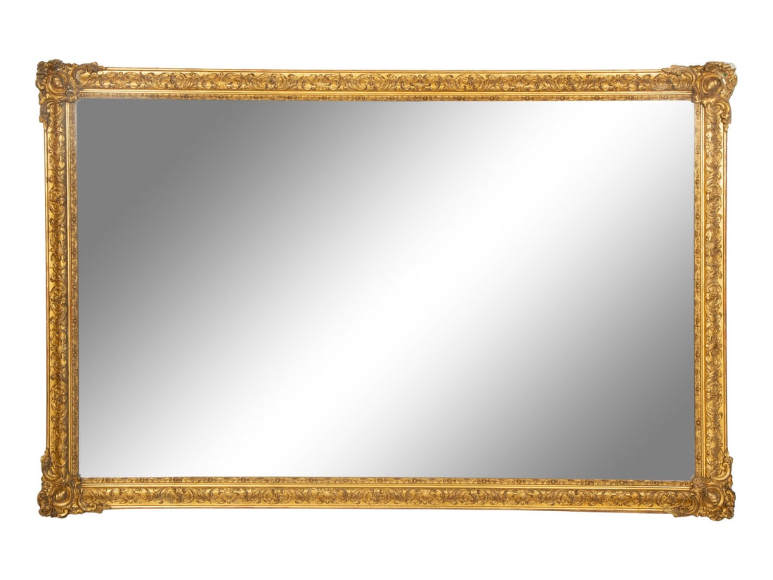 A Régence Style Carved Giltwood Mirror: A Régence Style Carved Giltwood Mirror 19th Century Height 57 x width 87 1/2 inches. This lot is located in Palm Beach.