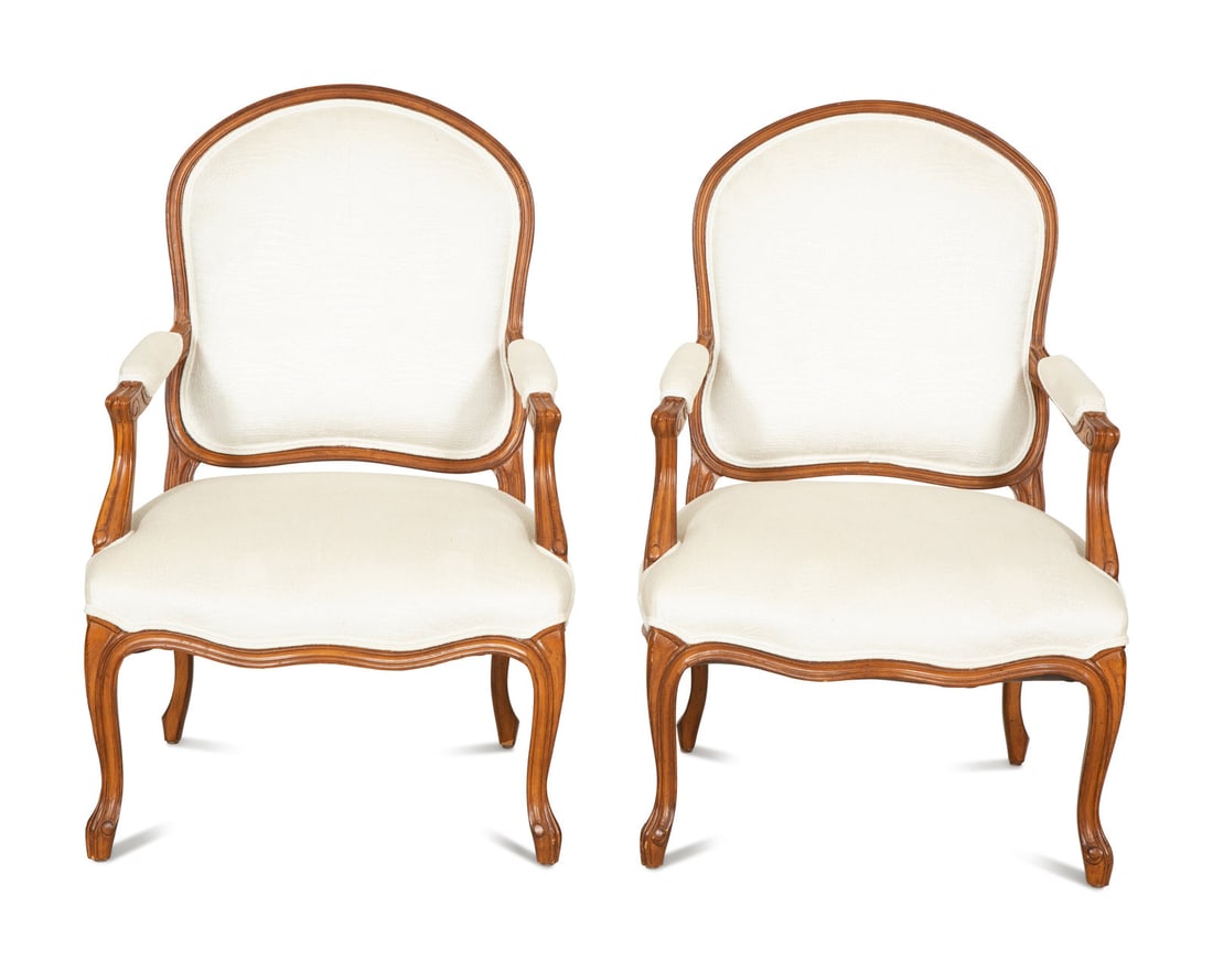 A Pair of Louis XV Style Beechwood Fauteuils: A Pair of Louis XV Style Beechwood Fauteuils 20th Century with white Brunschwig & Fils upholstery. Height 38 3/4 x width 25 1/2 x depth 23 inches. This lot is located in Palm Beach.