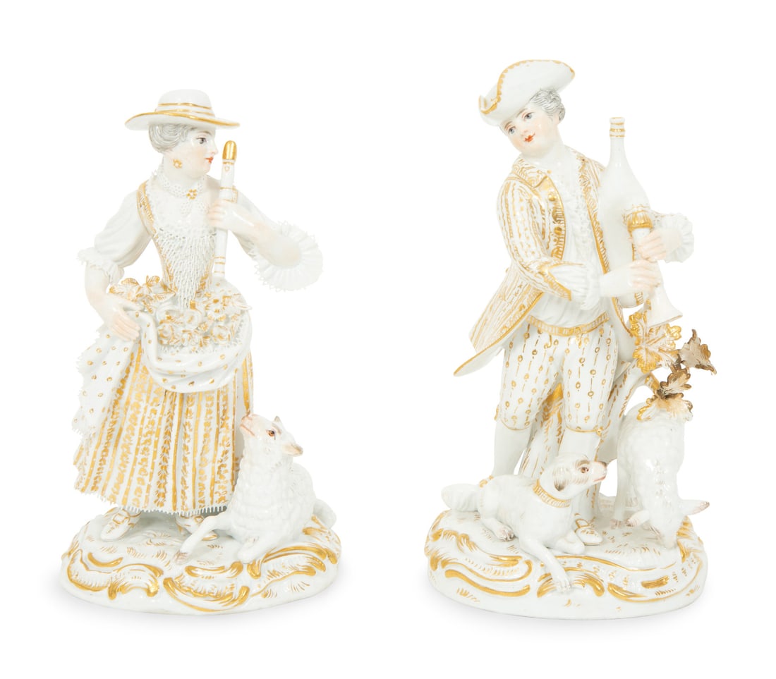 A Pair of Partial Gilt Meissen Porcelain Figures of a Man and Woman: A Pair of Partial Gilt Meissen Porcelain Figures of a Man and Woman 19th Century each bearing crossed swords in underglaze blue with additional incised and impressed marks to underside. Taller example