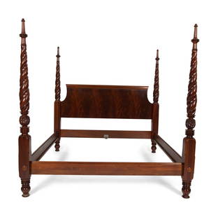 An American Carved Mahogany Four Poster Bed: An American Carved Mahogany Four Poster Bed 20th Century with side rails. Height 86 x width 84 inches. This lot is located in Palm Beach.