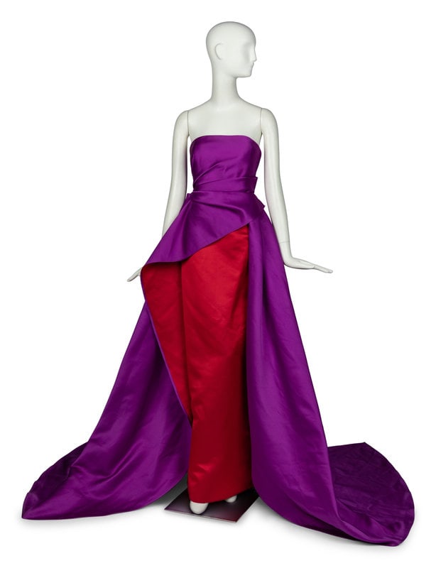 Carolina Herrera Strapless Gown: Carolina Herrera Strapless Gown Strapless column gown with overskirt in double-face bicolor silk satin. Dress features structured mesh bodice and a rear zipper/hook closure at center back. L