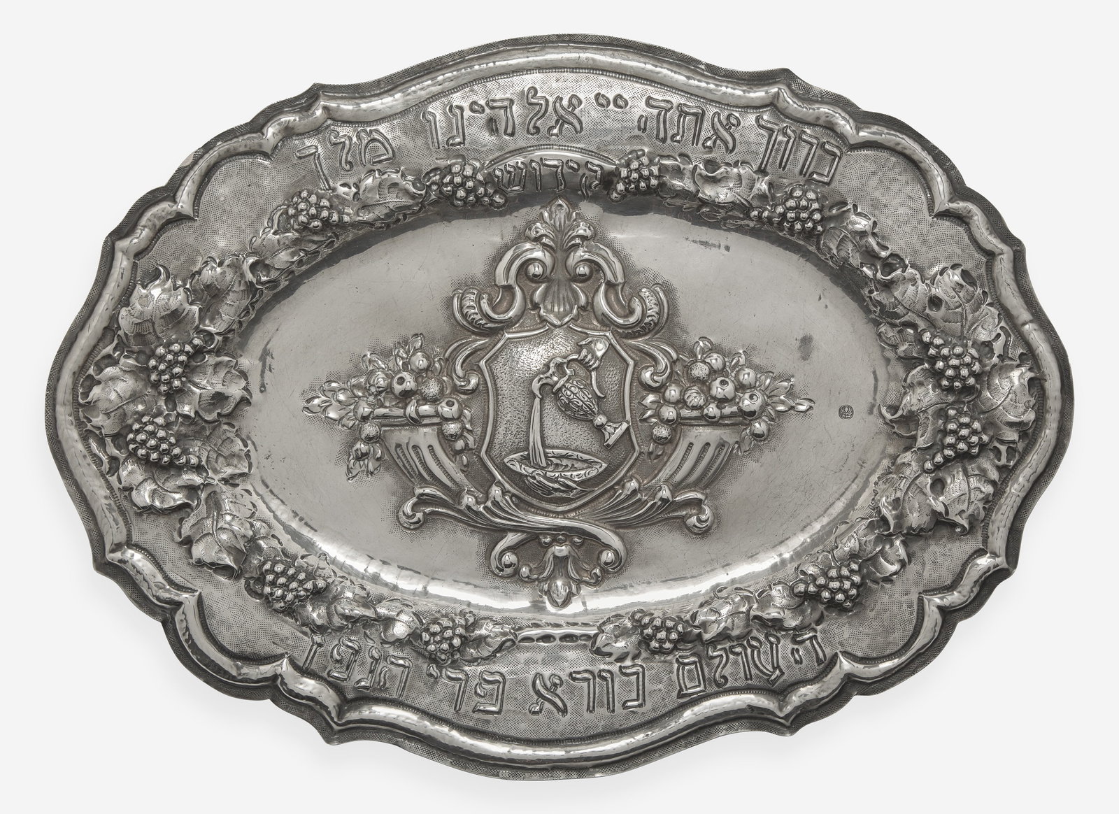 A silver repoussé Kiddush plaque, 20th century   Marked.  12 ½ in. x 17 ¼ in., (1 of 2)