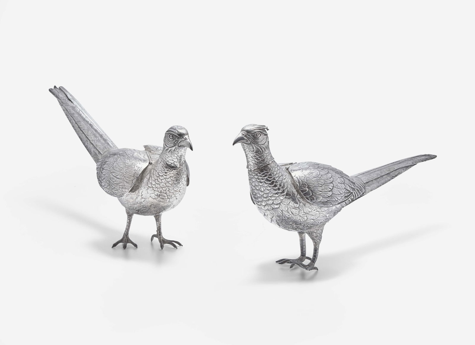 A pair of .800 silver pheasant-form decanters, Vereinigte Silberwarenfabrik, Hanau, Germany, early (1 of 2)